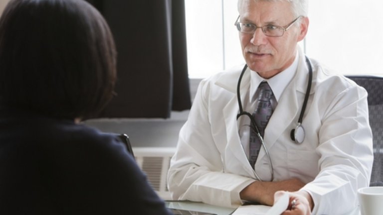 Male doctor talking to a patient