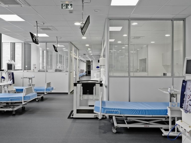 Inside view of a clinic with several empty beds