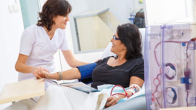 Nurse and patient during dialysis treatment
