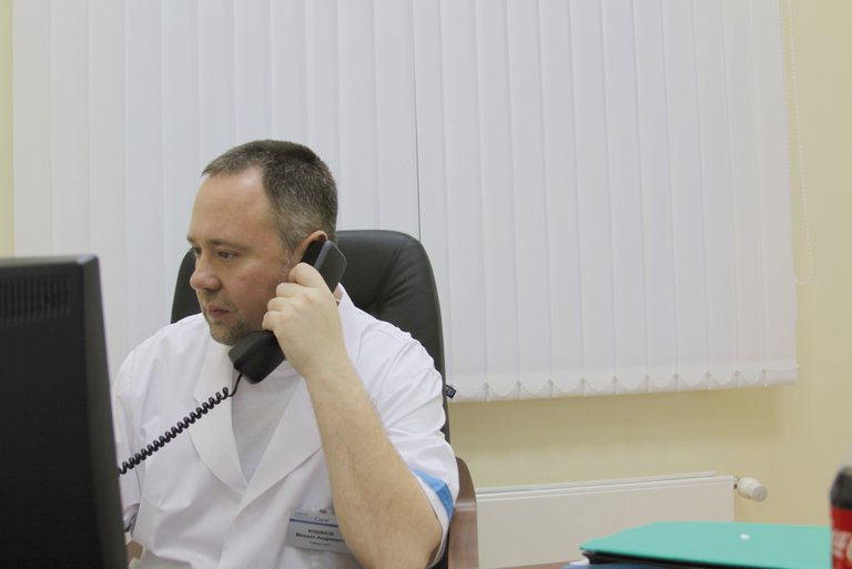 Dr. Michael Kokinov talking on the phone